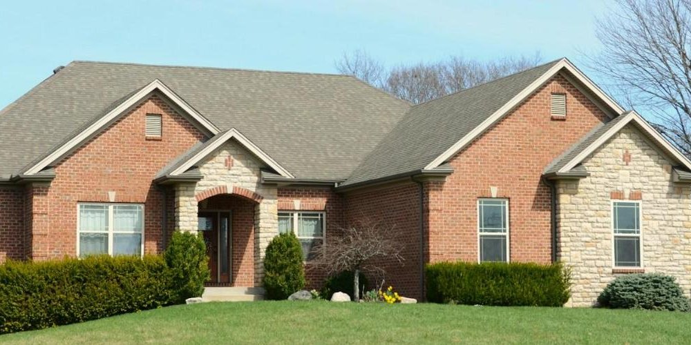 Close view of a finished shingle roof and gable